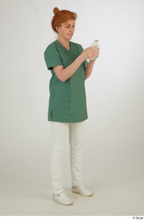 Photos Daya Jones Nurse in green Pose 2 preparing medication…